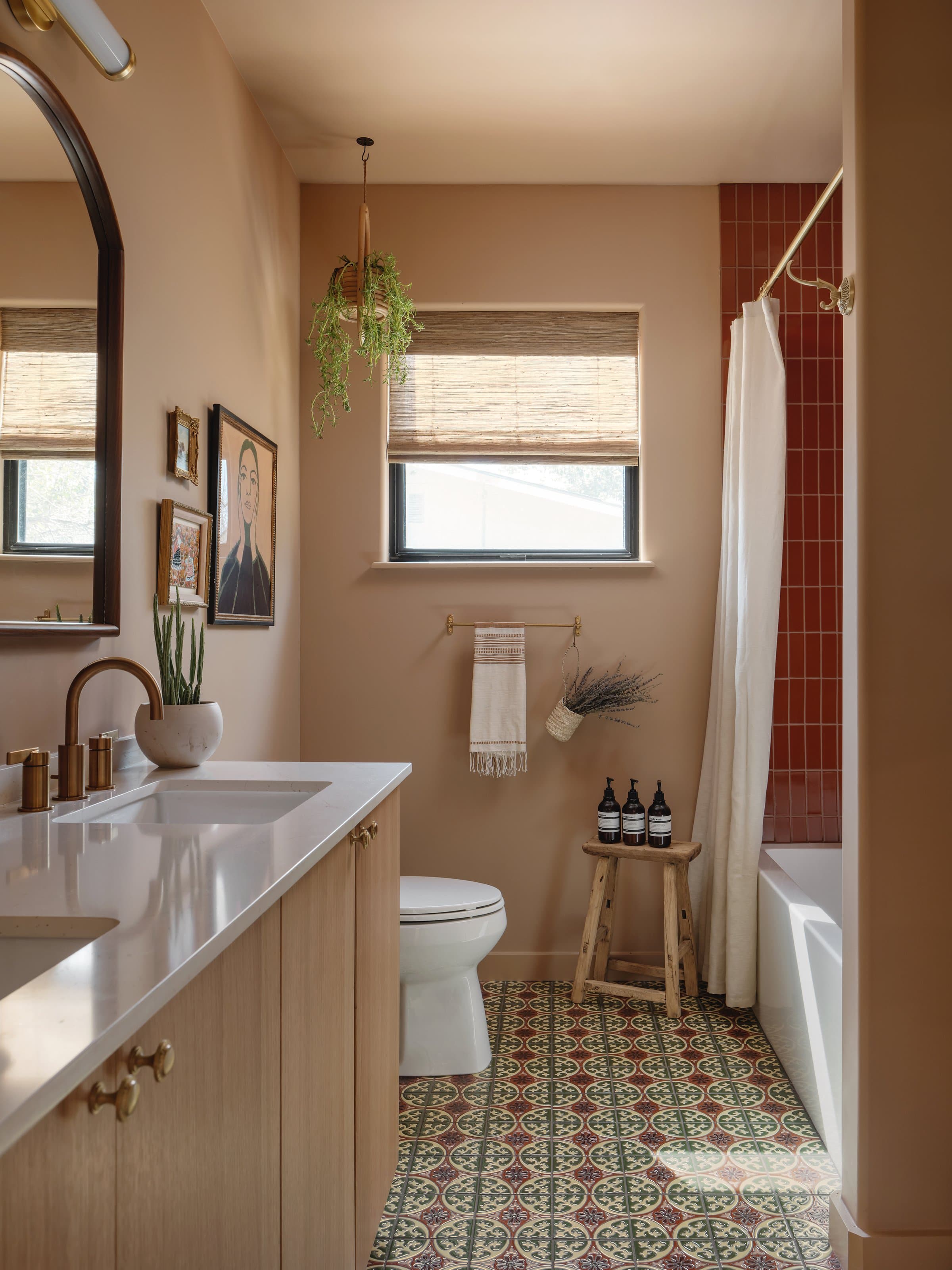Master bathroom double vanity with brass fixtures at Casa Alegre Fredericksburg Texas