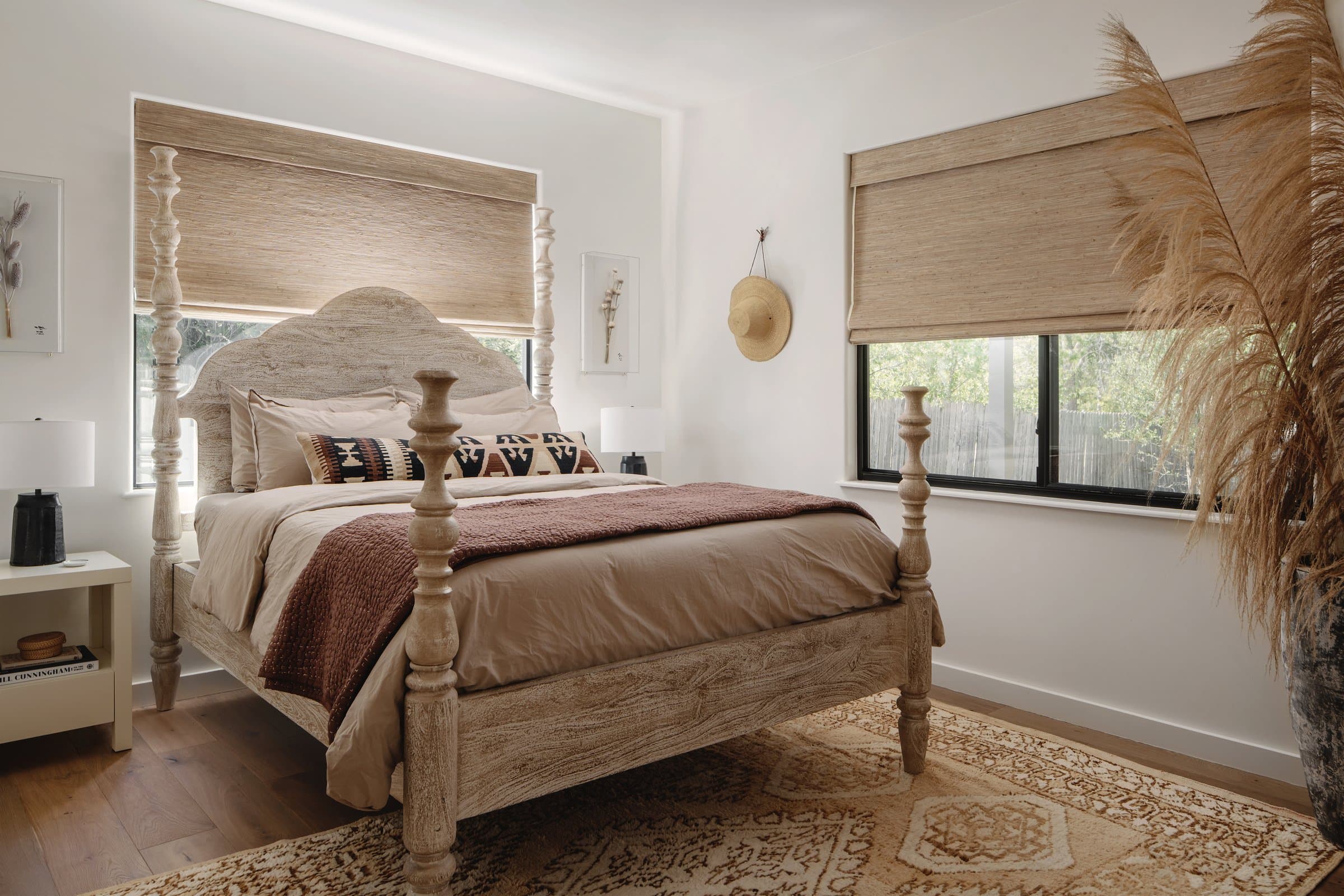 Boho bedroom with four poster bed at Casa Alegre Fredericksburg Texas